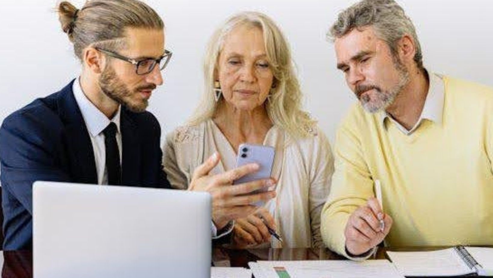 a man explaining to clients how to pay